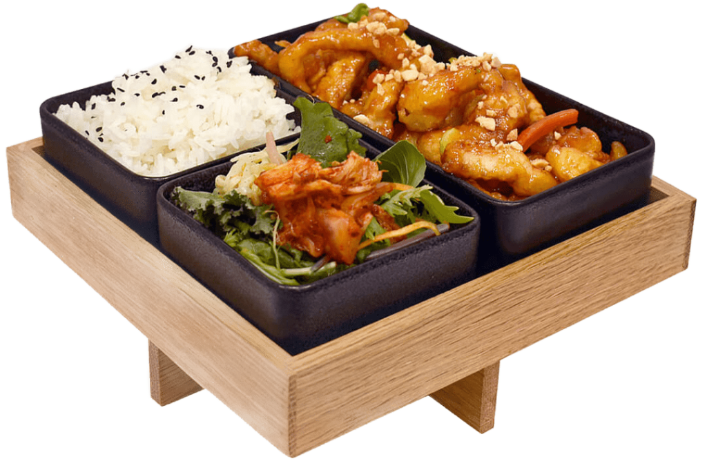 Korean chicken dish on a wooden platter
