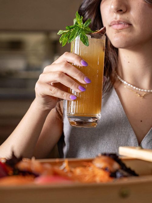 Woman drinking cocktail