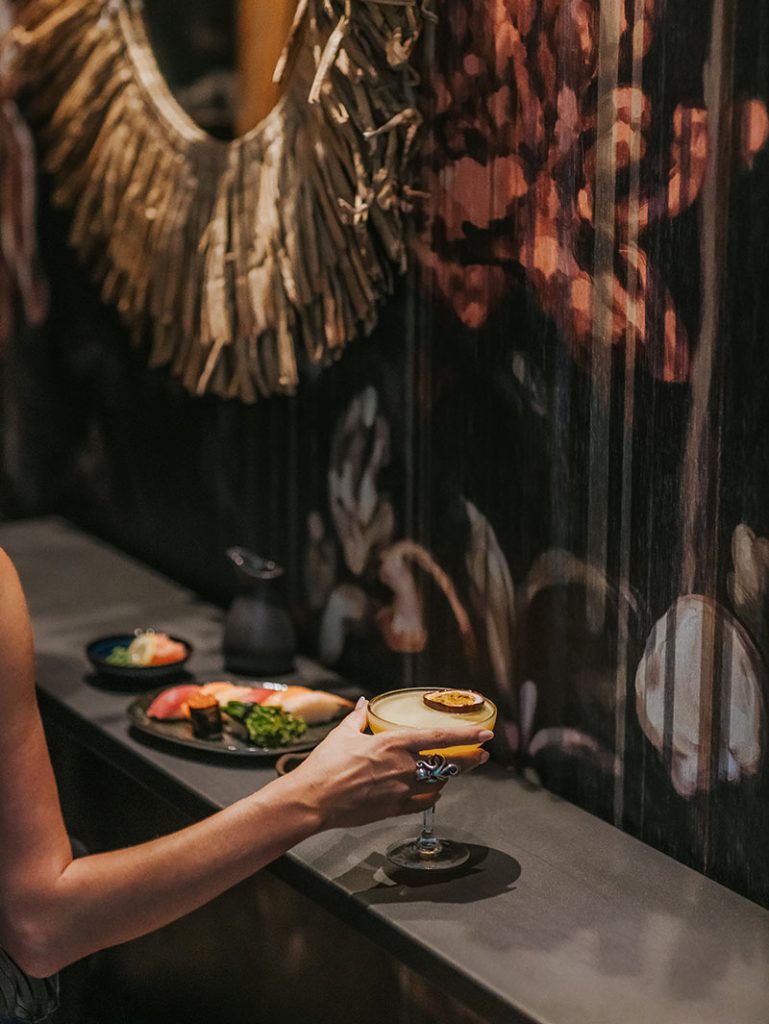 woman drinking cocktails at the bar