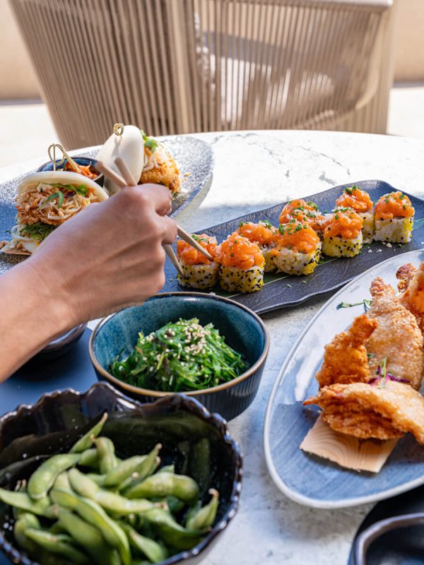 Table full of asian inspired dishes