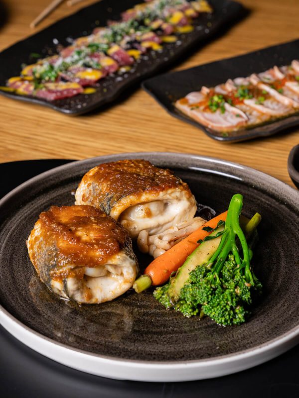 asian inspired dish with meat and grilled vegetables