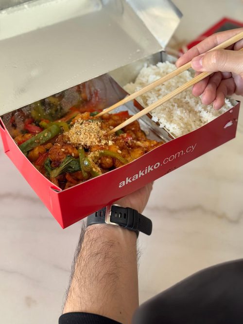 Man eating food from akakiko box