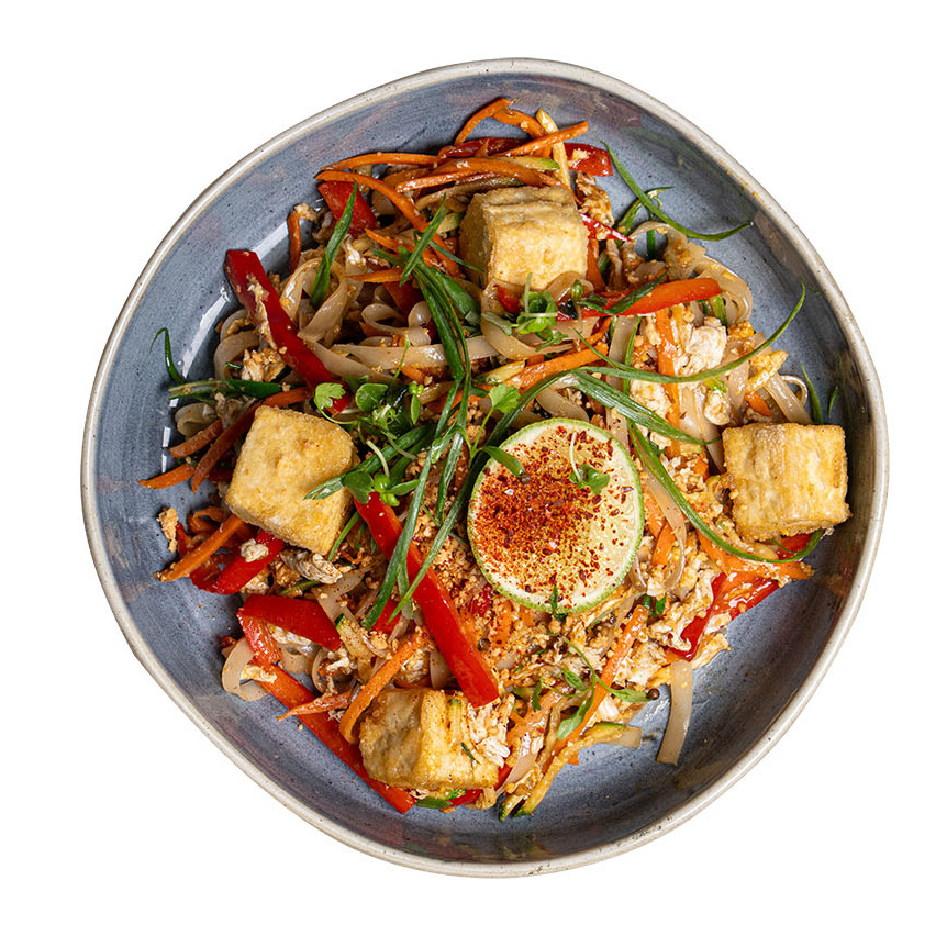 Noodles plated nicely with tofu and greens