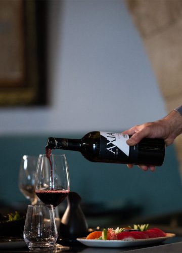 Waiter serving wine