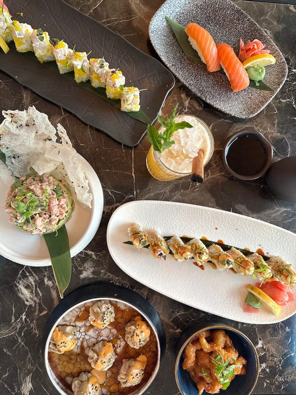 Table full of sushi rolls